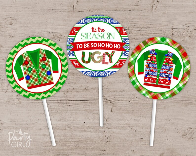 May include: Three round cupcake toppers with a green, red, and white Christmas sweater design. The top topper says "Tis the season to be so ho ho ho ugly".