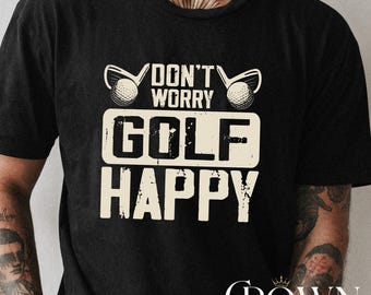 May include: Black t-shirt with the text "DON'T WORRY GOLF HAPPY" in a distressed, off-white font. The design includes golf clubs and a golf ball. The shirt also has the text "CROWN CUSTOM SHIRT" in a script font.