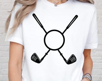 May include: White t-shirt featuring a black graphic of two crossed golf clubs with a circle in the center. The design is simple and bold, perfect for golf enthusiasts.