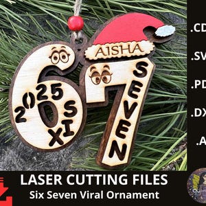 May include: Wooden Christmas ornament with the numbers "6" and "7" in a playful design, with the name "Aisha" and a Santa hat. The ornament includes the text "2025" and "Six Seven Viral Ornament".