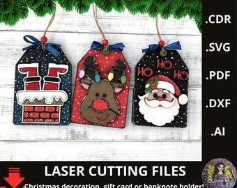 May include: Three Christmas gift tags with festive designs. One tag features Santa's legs in a chimney, another a reindeer with lights, and the last Santa Claus with "HO HO HO" text. Each tag is adorned with a bow and string.