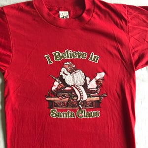 80er Jahre Weihnachten Kinder Vintage rot geschwollene T Shirt, ich glaube an Weihnachten, Santa, nostalgische entzückende Urlaub Spaß