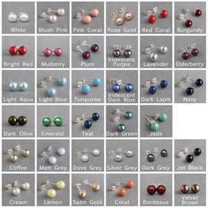 May include: A collection of 24 pairs of pearl earrings in various colors, including white, blush pink, pink coral, rose gold, red coral, burgundy, bright red, mulberry, plum, iridescent purple, lavender, elderberry, light aqua, light blue, turquoise, iridescent dark blue, dark lapis, navy, dark olive, emerald, teal, dark green, jade, coffee, matt grey, dove grey, silver grey, dark grey, jet black, cream, lemon, satin gold, coral, bordeaux, and velvet brown.