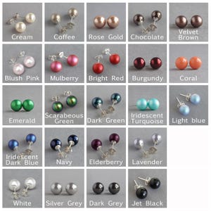 May include: A collection of 16 pairs of pearl earrings in various colours, including cream, coffee, rose gold, chocolate, velvet brown, blush pink, mulberry, bright red, burgundy, coral, emerald, scarab green, dark green, iridescent turquoise, light blue, iridescent dark blue, navy, elderberry, lavender, white, silver grey, dark grey, and jet black.