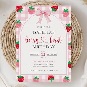 May include: A pink and white gingham-patterned invitation with strawberry illustrations. The text reads "Join us for Isabella's berry first birthday" with date and location details. A pink bow and strawberry accents frame the text.