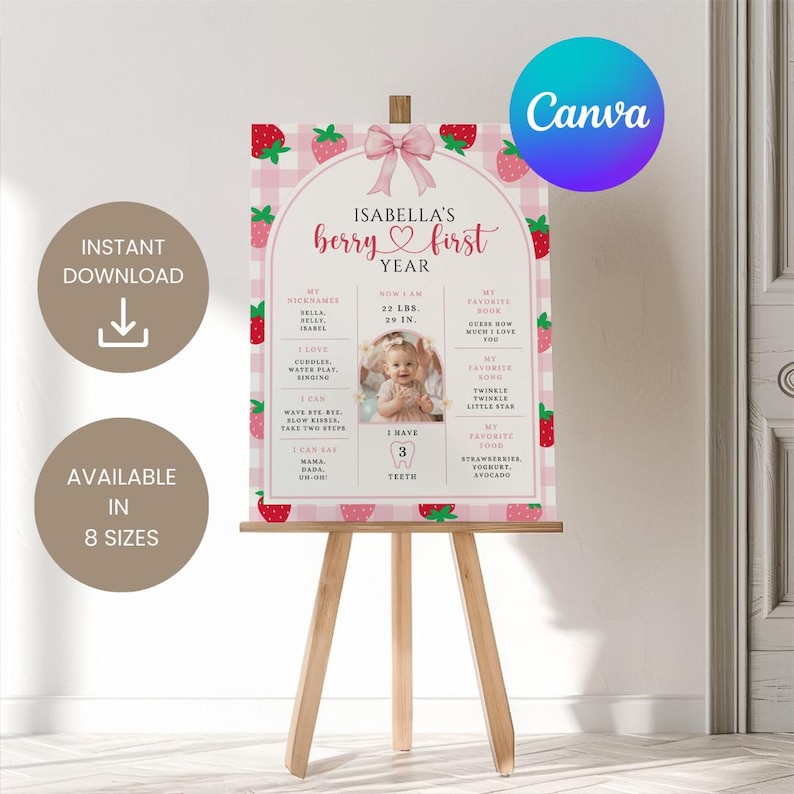 May include: A pink and white strawberry-themed first birthday sign on a wooden easel. The sign features the text "Isabella's berry first year" and includes a photo, measurements, and favorite things. The sign is available in 8 sizes.