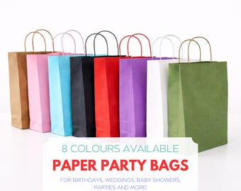 May include: A collection of eight colorful paper party bags, each with a matching handle. The bags come in various colors, including brown, pink, blue, black, red, purple, white, and green. Text on the image reads: "8 COLOURS AVAILABLE PAPER PARTY BAGS FOR BIRTHDAYS, WEDDINGS, BABY SHOWERS, PARTIES AND MORE!"