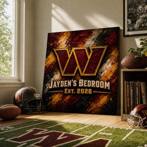 May include: A square wall art print featuring a large burgundy and gold letter W logo, with the text JAYDEN'S BEDROOM and EST. 2026 printed below. The background has a textured, brushstroke pattern in shades of burgundy, gold, and black.