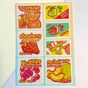 May include: A sheet of stickers featuring colorful illustrations of bubble gum flavors. Flavors include orange, green apple, peach, strawberry, grape, and melon. Each sticker has the flavor name and "BUBBLE GUM" text. The net weight is 5.4g.