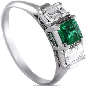 Authentic Exclusive Platinum 0.78ct Diamond and Emerald Ring