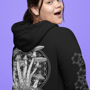 May include: Black hoodie featuring a white graphic of mushrooms and geometric patterns. The graphic depicts a cluster of mushrooms with a flower of life design.