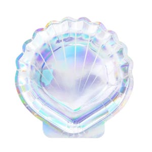 May include: A iridescent white paper plate shaped like a seashell. The plate is perfect for a mermaid or ocean-themed party.