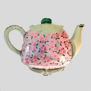 Peut inclure: Un grand ballon en forme de théière rose avec un motif de roses fleuries. Le ballon a un couvercle et une poignée verts, et un bec et une base argentés. Conçu pour les décorations de fête.