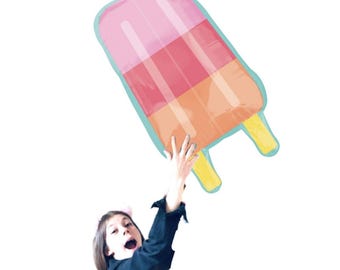 May include: A large, colorful popsicle-shaped inflatable balloon. The balloon features pink, red, and orange sections with a light blue border and yellow stick handles. The balloon is held up in the air.