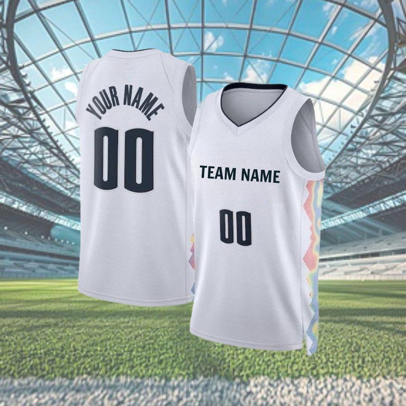 May include: Two white basketball vests with black text and numbers. One vest reads "YOUR NAME" and "00" on the back. The other reads "TEAM NAME" and "00" on the front. Both have a colourful design on the side.