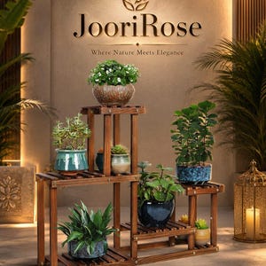 May include: A multi-tiered, wooden plant stand with various potted plants. The stand is stained a warm brown and features the text "JooriRose Where Nature Meets Elegance". The plants include succulents and flowering varieties in ceramic pots.