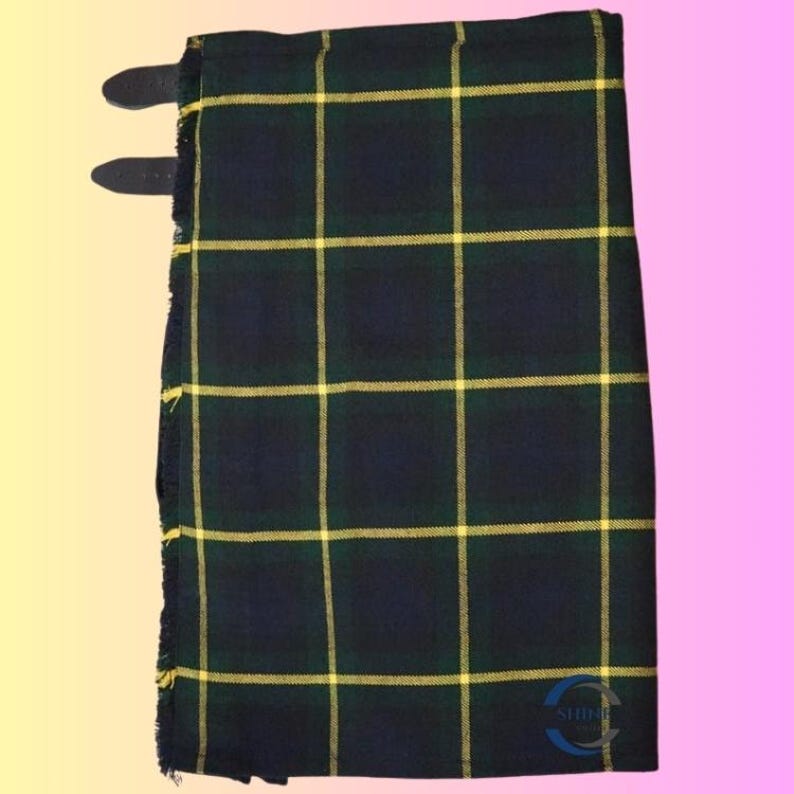 May include: A folded kilt in a dark blue, green, and yellow plaid pattern. The kilt has two leather straps with buckles. The fabric has a fringed edge. The kilt is a traditional Scottish garment.