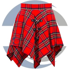 May include: A red plaid skirt with a unique asymmetrical design. The skirt features a bold red color with a classic plaid pattern in yellow, blue, and black. It has black leather straps with silver metal rings and buckles for closure. The skirt is a stylish fashion item.