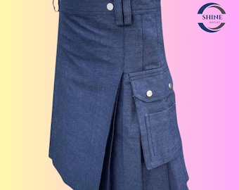 May include: A denim kilt in a medium blue hue. The kilt features pleats, a front pocket with a button closure, and two buttons at the waistband. The kilt has a traditional design with a modern denim fabric.
