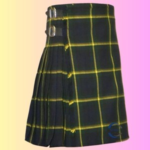 May include: A traditional kilt in a dark green and yellow plaid pattern. The kilt features pleats on the left side and is secured with two leather straps and buckles. The fabric has a woven texture.