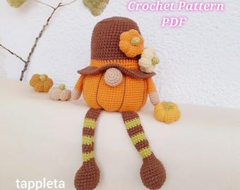 May include: A crocheted pumpkin-themed doll with a brown hat and legs striped with green and brown. The doll has an orange body and is adorned with crocheted flowers. The text "Crochet Pattern PDF" is visible in the image.