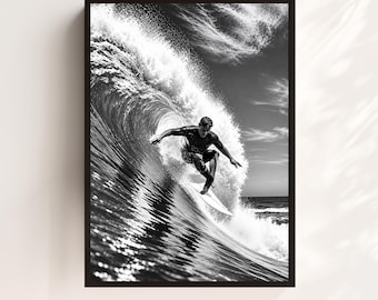 May include: A black and white framed wall art print depicting a surfer riding inside a large, curling ocean wave. The surfer is positioned on a surfboard, leaning into the turn while surrounded by white sea spray and dark, textured water.