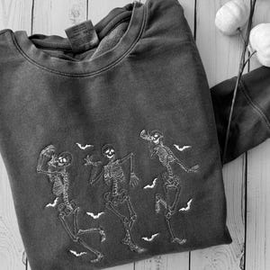 Embroidered skeletons sweatshirt for fall and halloween unisex sizing dark gray or orange.