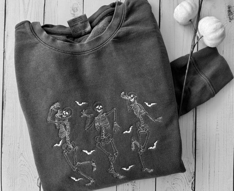 Embroidered skeletons sweatshirt for fall and halloween unisex sizing dark gray or orange.
