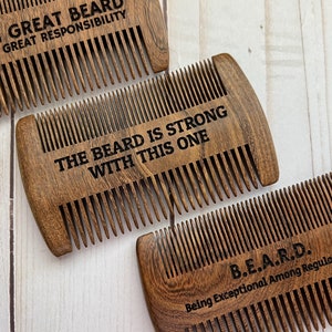 May include: Three wooden beard combs with engraved sayings. The first comb says "With great beard comes great responsibility." The second comb says "The beard is strong with this one." The third comb says "B.E.A.R.D. Being Exceptional Among Regular Dudes."