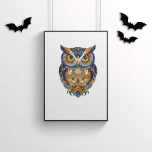 May include: Framed art print featuring a detailed owl illustration. The owl is depicted with intricate patterns in shades of blue, gold, and brown. The artwork is displayed in a black frame, with black bat decorations on the wall.