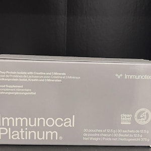 May include: A gray box of Immunocal Platinum food supplement. The box includes text in English, French, and German, listing ingredients and the Immunotec logo. It contains 30 pouches of 12.5 grams each.
