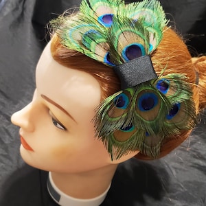 1 Peacock Feather piece, 1 pheasant feather piece and 1 aluminum flowe interchangable piece