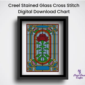 May include: Framed digital cross stitch chart with a stained glass design. The artwork features a red rose in the center, surrounded by green leaves and a blue background. The frame is black, and the text at the top reads "Creel Stained Glass Cross Stitch Digital Download Chart."