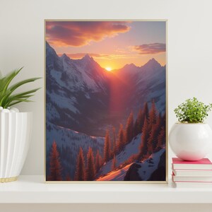 May include: A framed landscape art print depicting a mountain range at sunset. The snow-capped peaks are illuminated by the setting sun, with a warm orange and red glow. The foreground features evergreen trees.