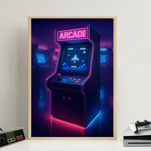 May include: A framed print featuring a neon-lit arcade game cabinet. The cabinet has a screen displaying a spaceship game, with the word "READY" visible. The word "ARCADE" is displayed at the top. The cabinet is outlined in pink and blue neon.