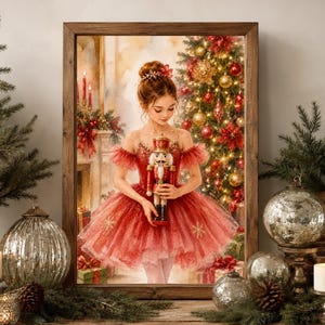 May include: A framed wall art print depicting a person with hair in a bun wearing a red tulle ballet dress, holding a traditional nutcracker figurine. The background features a decorated Christmas tree with red and gold ornaments and a fireplace.
