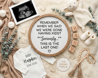 May include: A pregnancy announcement with a sonogram, a letter board with text, a baby onesie, and wooden blocks spelling "BABY." The onesie says "Baby Hayden June 2026." A plush lamb and baby booties are also present.