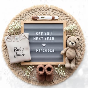 May include: A pregnancy announcement with a gray letter board that reads "SEE YOU NEXT YEAR MARCH 2026." A beige onesie with "Baby John" printed on it, a crochet teddy bear, and baby booties are arranged on a woven mat.