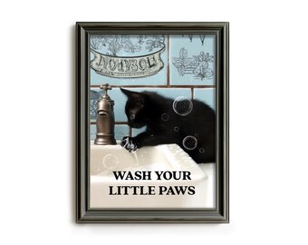 May include: Framed print featuring a black cat washing its paws in a white sink. The image includes a vintage faucet, bubbles, and the text "WASH YOUR LITTLE PAWS". The background has blue tiles with decorative patterns.