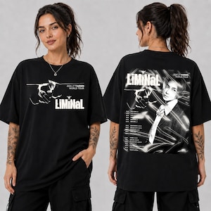 May include: A black short-sleeve t-shirt featuring white graphic prints. The front displays the text 'LiMiNaL' and '2026-27 TAEMIN WORLD TOUR'. The back features a portrait of a person, the text 'LiMiNaL', and a list of tour dates and cities.