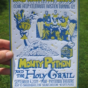 May include: A blue and yellow invitation card for a Monty Python and the Holy Grail themed birthday party. The card features a graphic of the Holy Grail and the text "AND NOW AT LAST! COME HELP CELEBRATE BASTIEN TURNING 12!"  The card also includes the text "MONTY PYTHON AND THE HOLY GRAIL" and details about the party, including the date, time, location, and RSVP information.