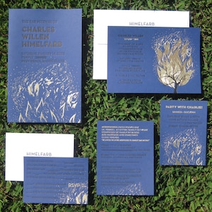 May include: Blue and gold bar mitzvah invitations with a design of a tree with flames. The text on the invitation reads "The Bar Mitzvah of Charles Willen Himmelfarb" and includes the date, time, and location of the event. The RSVP card is also included.