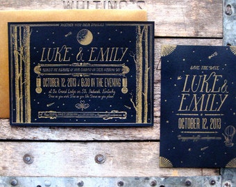 May include: Gold foil wedding invitation with black background. The invitation features the names "Luke & Emily" and the date "October 12, 2013".