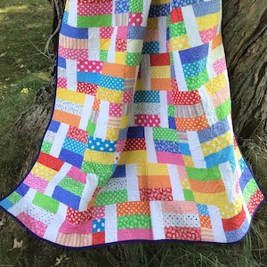 Experience the Joy in Quilts with Our Super Fun Primary Rainbow Throw Quilt - An Original Design for a Modern and Colorful Home