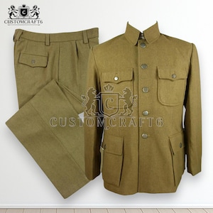 May include: A two-piece olive-drab suit, including a jacket and trousers. The jacket has a mandarin collar, multiple pockets, and button closures. The trousers have a classic design with pockets. The Customcraft6 logo is visible.