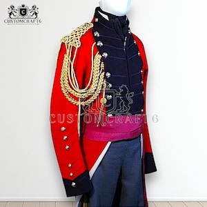 May include: A red military jacket with gold trim and buttons, a navy blue front, and a pink sash. The jacket has gold epaulettes and the text "CUSTOMCRAFT6".