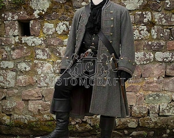 May include: A gray, double-breasted coat with gold buttons, part of a pirate costume. The coat is worn over a black vest and shirt, with a black scarf and leather belt. Black boots and pants complete the outfit. A sword is visible.