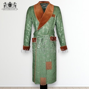 May include: A long, green robe with a floral pattern, featuring a brown velvet collar, cuffs, and pocket accents. The robe has a belt and decorative fringe. The text "CUSTOMCRAFT6" and a crest logo are visible.