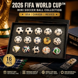 May include: A collection of 16 mini soccer balls in a black display case. The balls feature various designs and colors. Text on the box reads "2026 FIFA World Cup Mini Soccer Ball Collection" with "USA | CANADA | MEXICO" listed.
