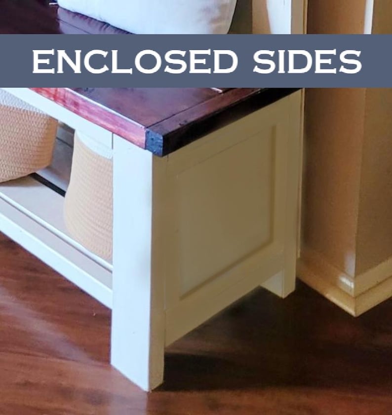 May include: A white bench with a dark wood top and enclosed sides. The bench has a shelf with woven baskets. The text "ENCLOSED SIDES" is displayed on a blue banner above the bench.